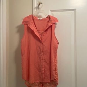 Peach colored sleeveless blouse with lace back.  Excellent condition